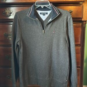 Charcoal gray zip Tommy Hilfiger sweater. Collar has navy.